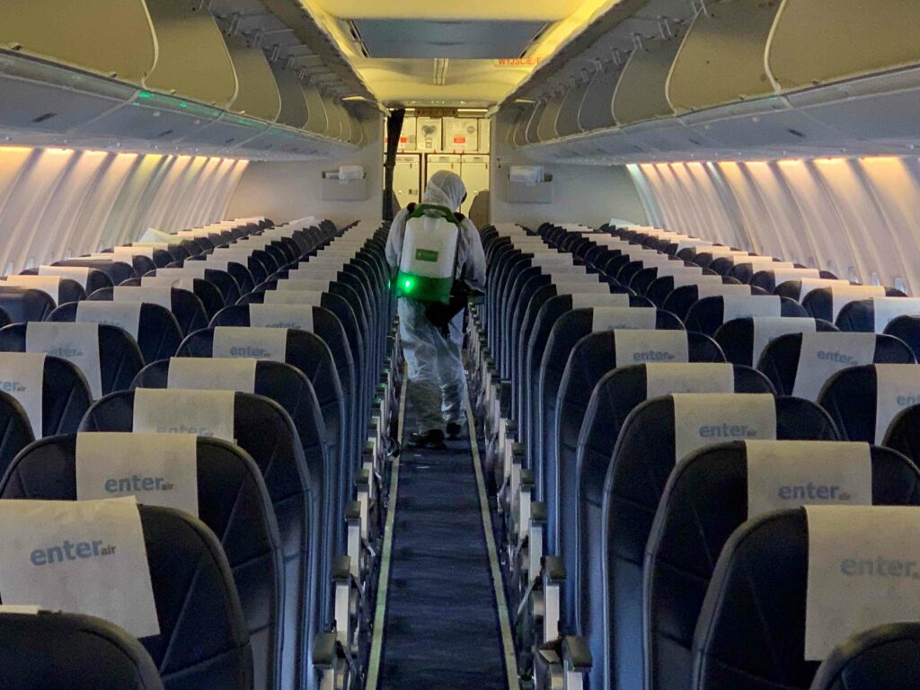 Man cleaning the airplane seats