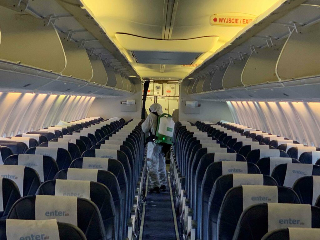 Man cleaning the airplane seats