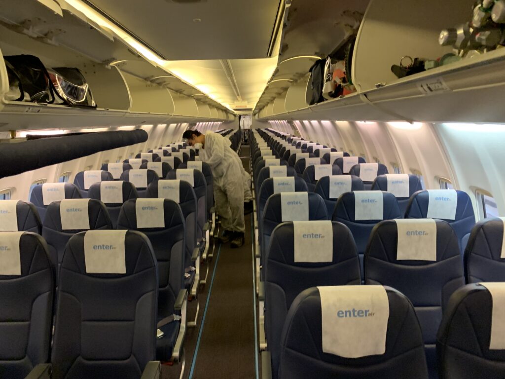 Men cleaning the seats