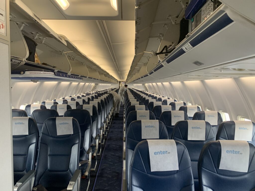 Men cleaning the airplane seats