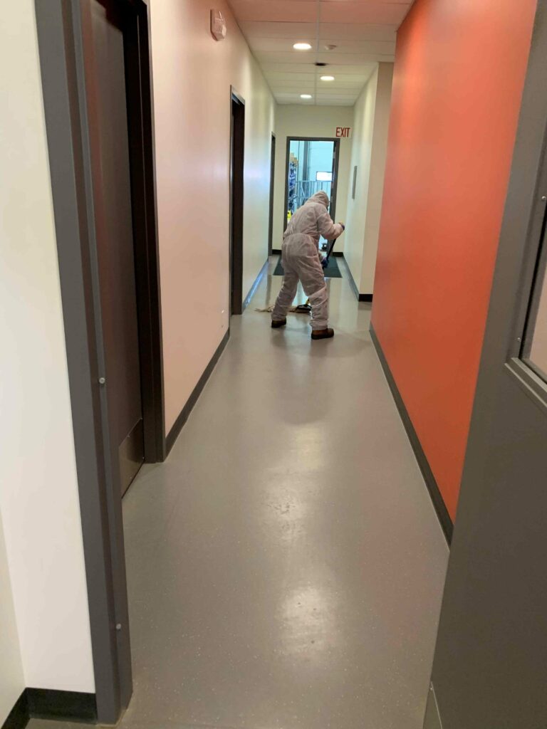 Man cleaning the hallway